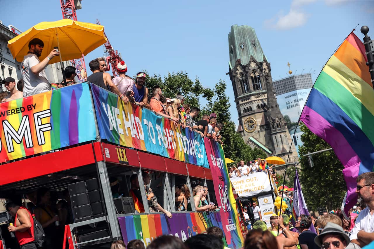 People participate in the 41th Christopher Street Day LGBT parade near the Berlin Memorial Church.