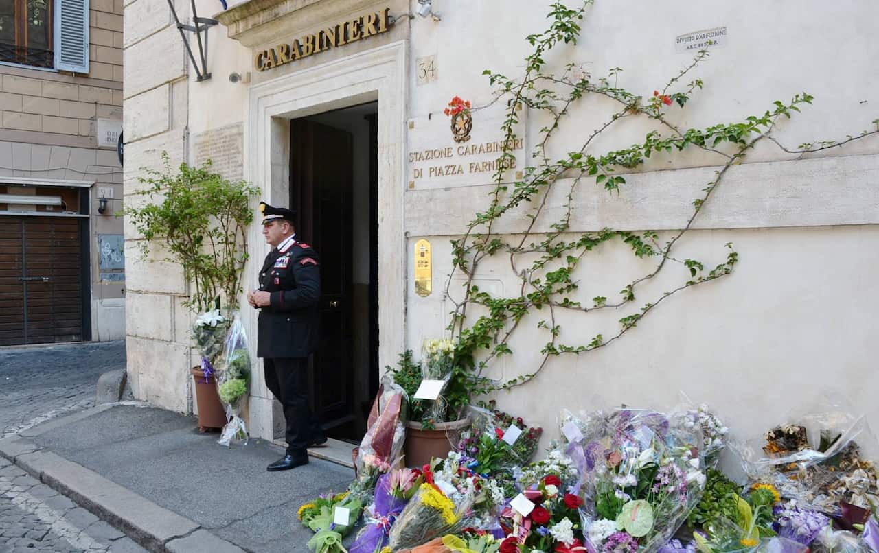 Flowers are layed out in front of the Carabinieri station in Piazza Farnese in tribute to policeman Mario Cerciello Rega who was murdered whilst trying to make an arrest in the centre of Rome..