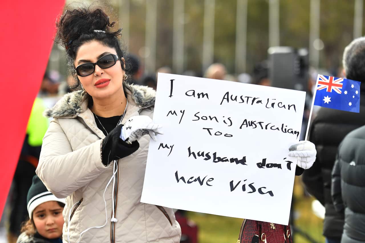 Temporary Protection Visa (TPV) and Safe Haven Enterprise Visa (SHEV) holders are seen as they attend a rally outside Parliament House in Canberra, Monday, 29 July, 2019. (AAP Image/Mick Tsikas) NO ARCHIVING