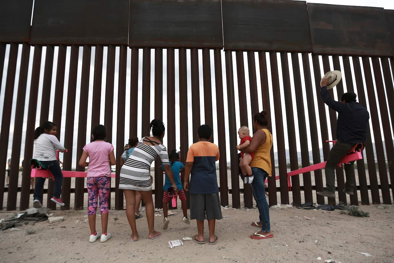 Seesaws in use at the border.