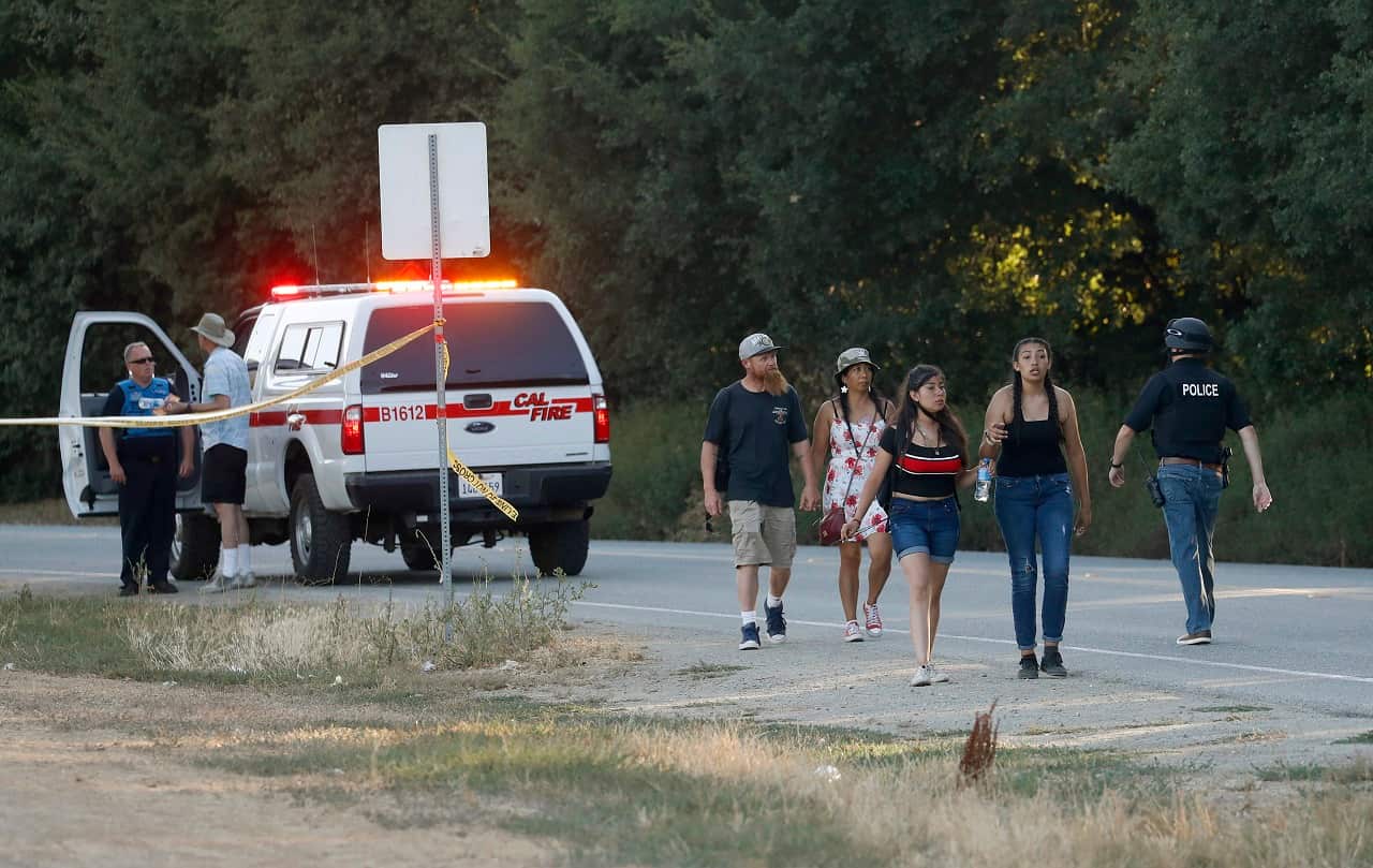 People leave the scene of the shooting.ilroy Garlic Festival following a deadly shooting in Gilroy, Calif., on Sunday, July 28, 2019. (Nhat V. Meyer/San Jose Mercury News via AP)