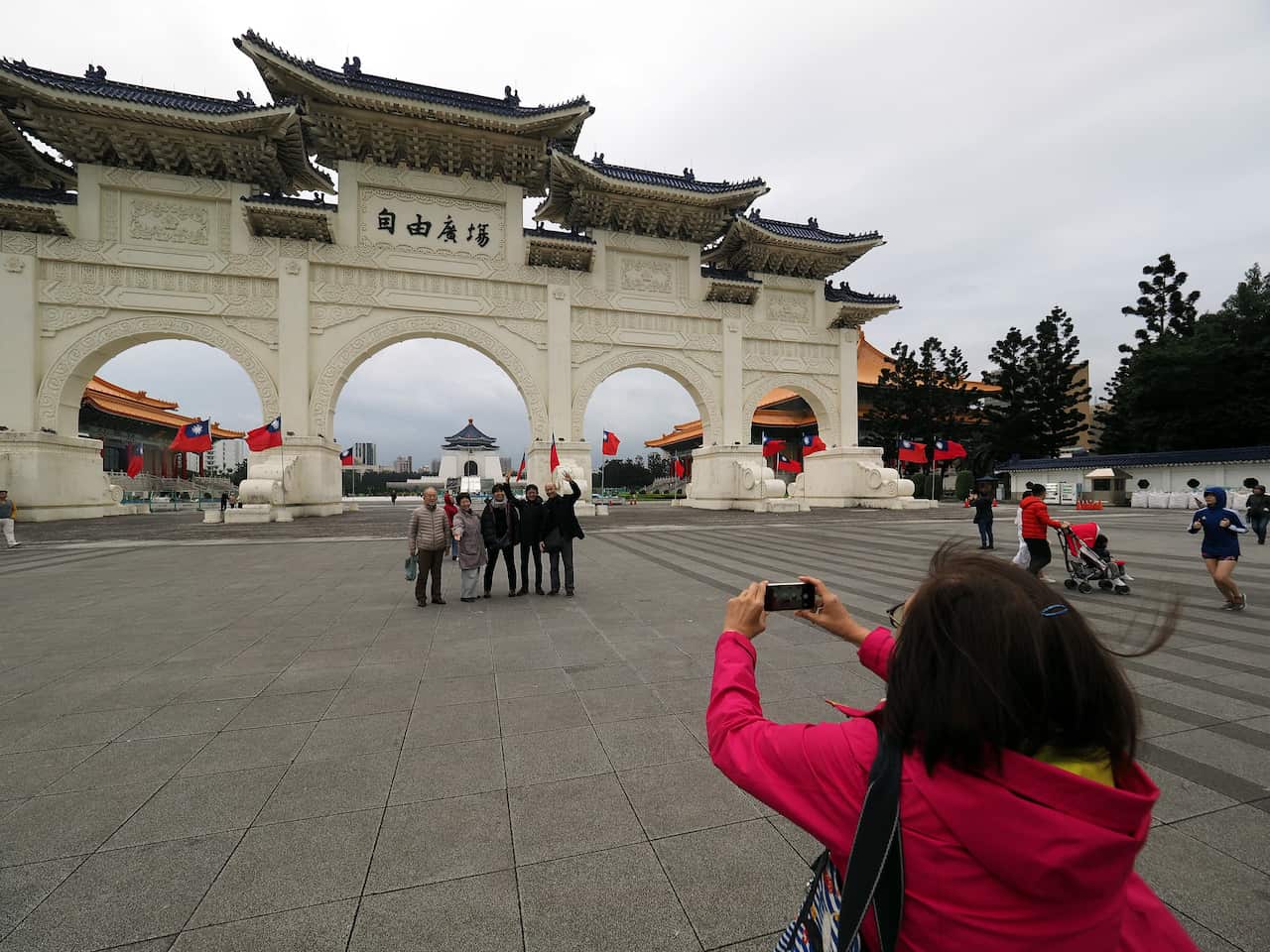 Tourists pose for photograph at the Liberty Square in Taipei, Taiwan.