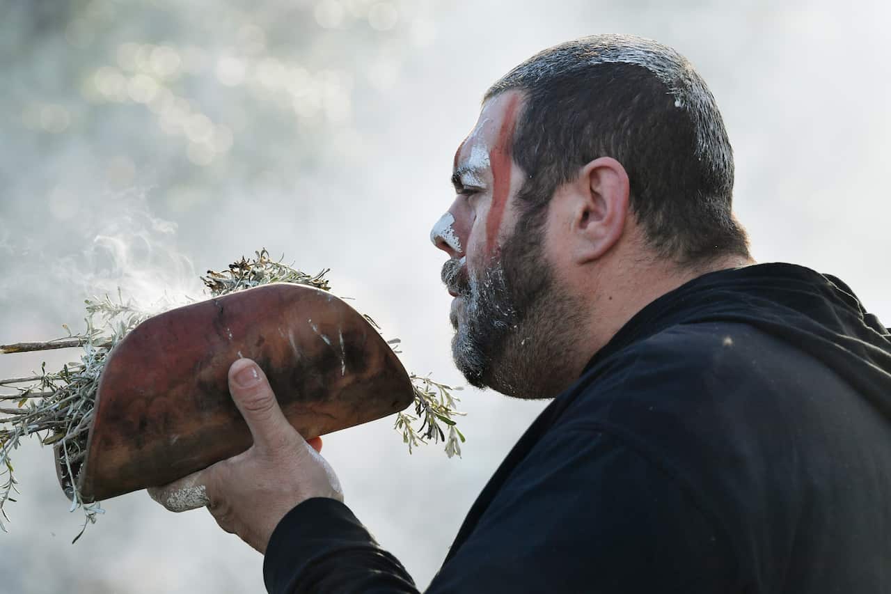 Cultural Bearer Allan Sumner is seen during a burial ceremony at Kingston Park in Adelaide, Thursday, August 1, 2019.