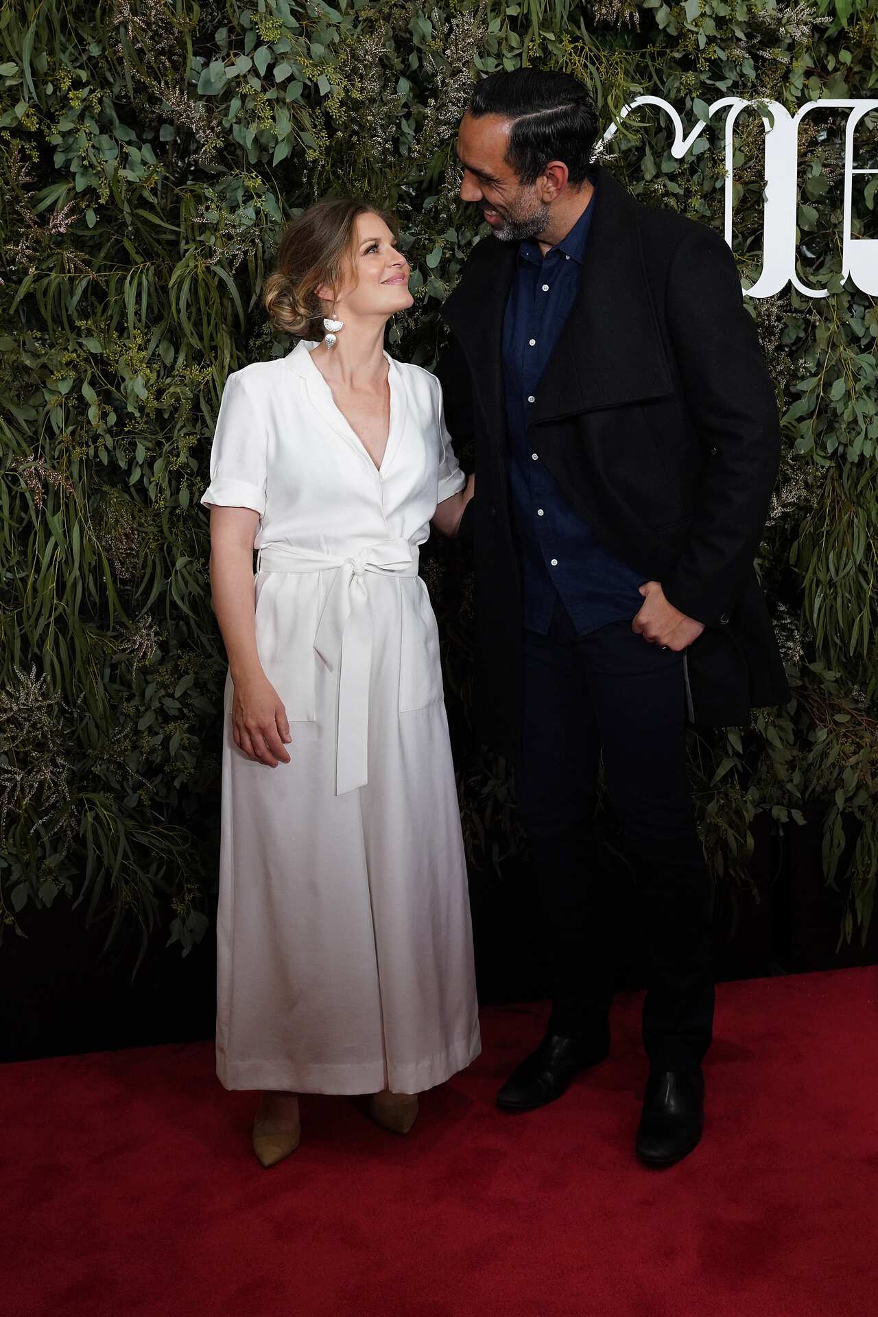 Adam Goodes and wife Natalie Goodes pose on the red carpet at the documentary's world premiere. 