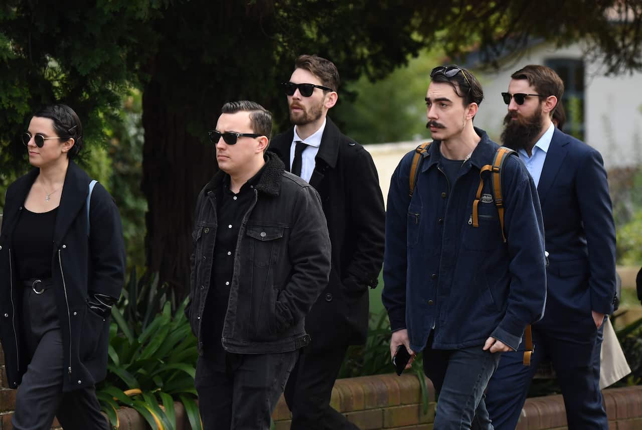 Friends and family arrive for the memorial service.