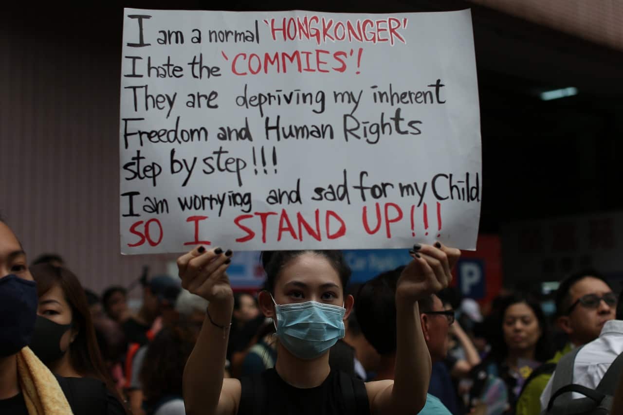 An anti-extradition bill protester holds a banner on Saturday.
