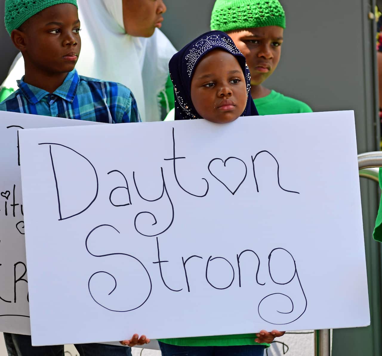 Crowds gather for a prayer vigil in downtown Dayton for the victims of a shooting in the Oregon District of Dayton, Ohio.