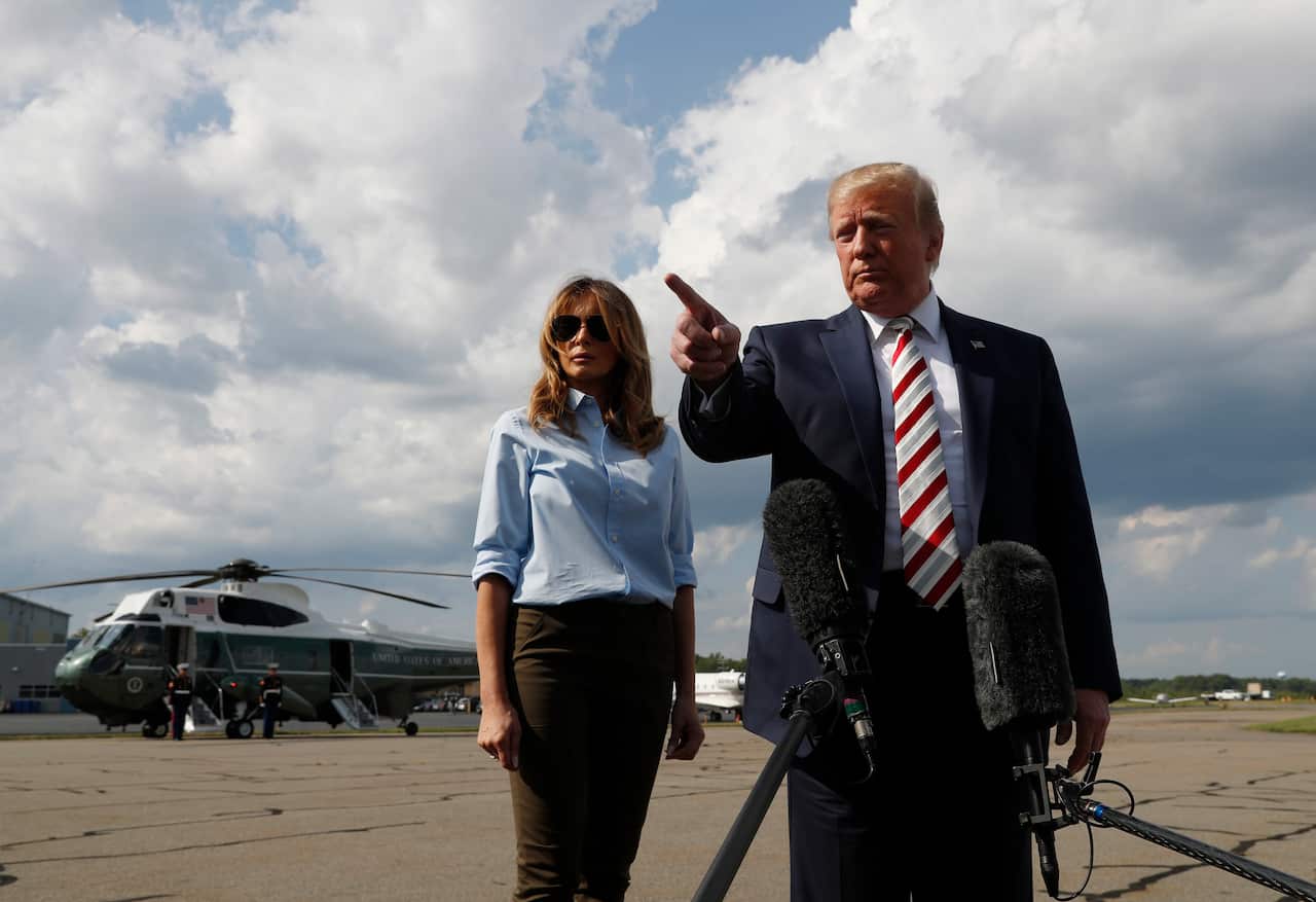 President Donald Trump speaks to the media about the recent mass shootings in El Paso, Texas, and Dayton, Ohio, as he boards Air Force One