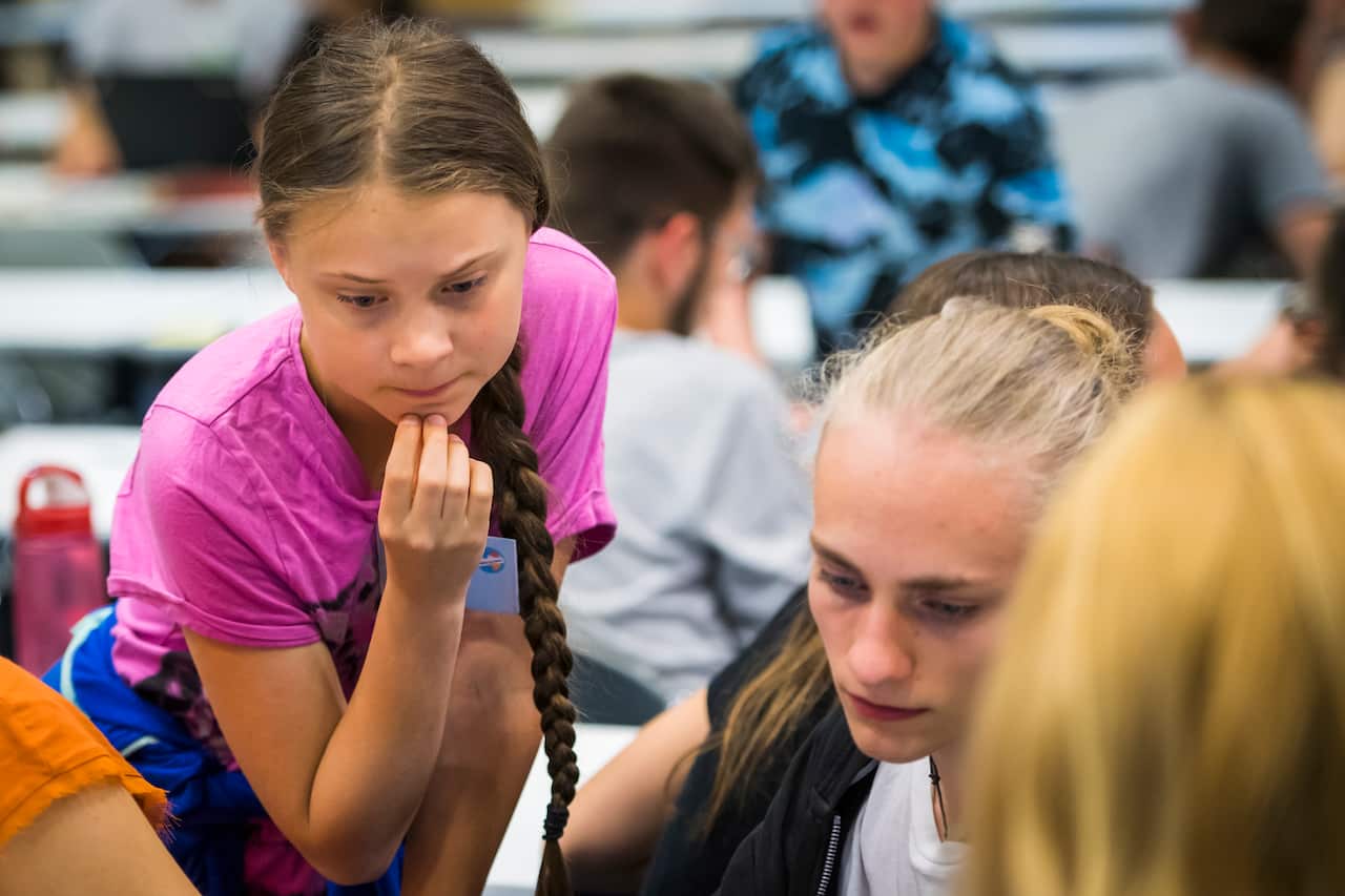 Swedish climate activist Greta Thunberg, left, attends the 'Fridays For Future Summit' at the University of Lausanne