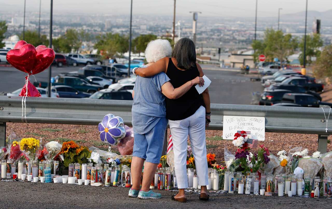 Emma Del Valle hugs Brenda Castaneda at a make shift memorial in El Paso. 