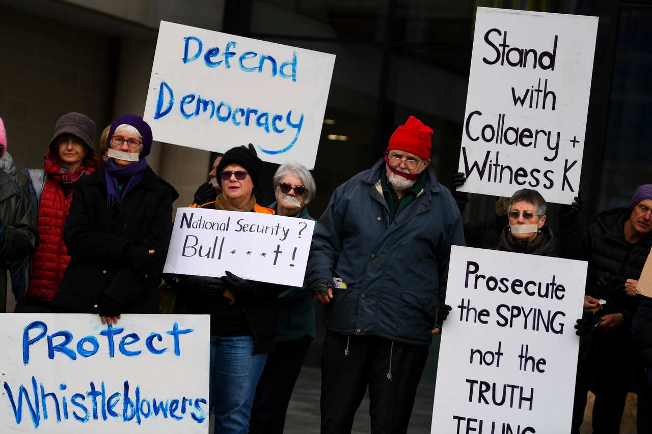 Supporters of lawyer Bernard Collaery and 'Witness K' stage a protest outside the Supreme Court in Canberra.