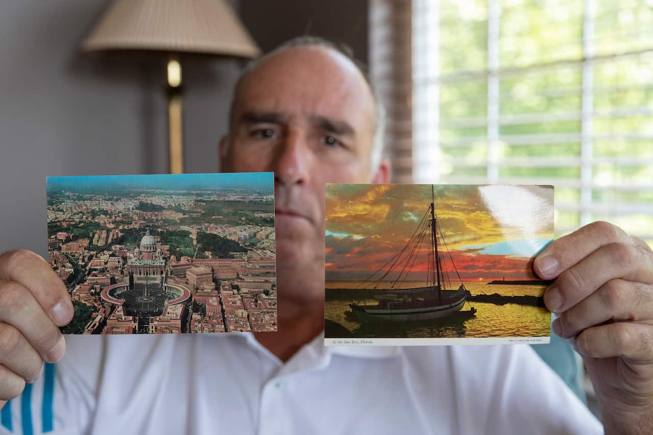 James Grein, 61, shows postcards sent to him as a boy by now-defrocked Cardinal Theodore McCarrick.