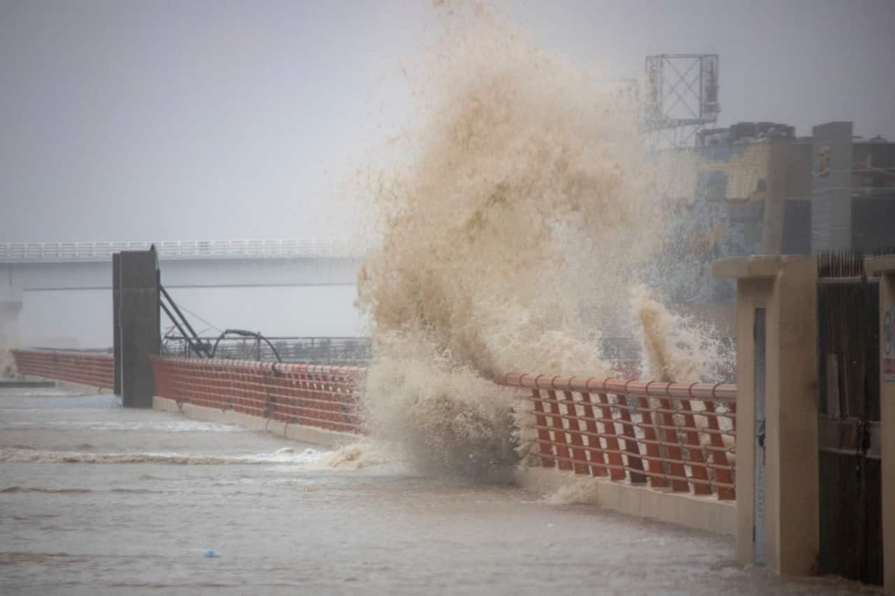 As Lekima, the ninth typhoon of the year, arrives, huge waves arise in Zhoushan city, east China's Zhejiang province, 9 August 2019. (Imaginechina via AP Images)