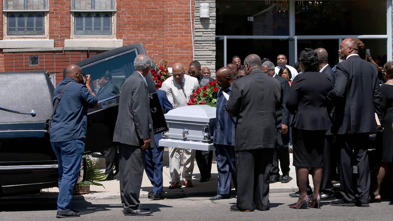 Friends and family mourn Derrick Fudge at a church in Springfield, Ohio. 