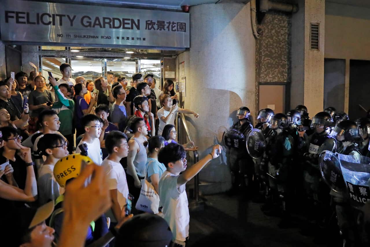 Riot policemen face off with resident at Sai wan Ho.
