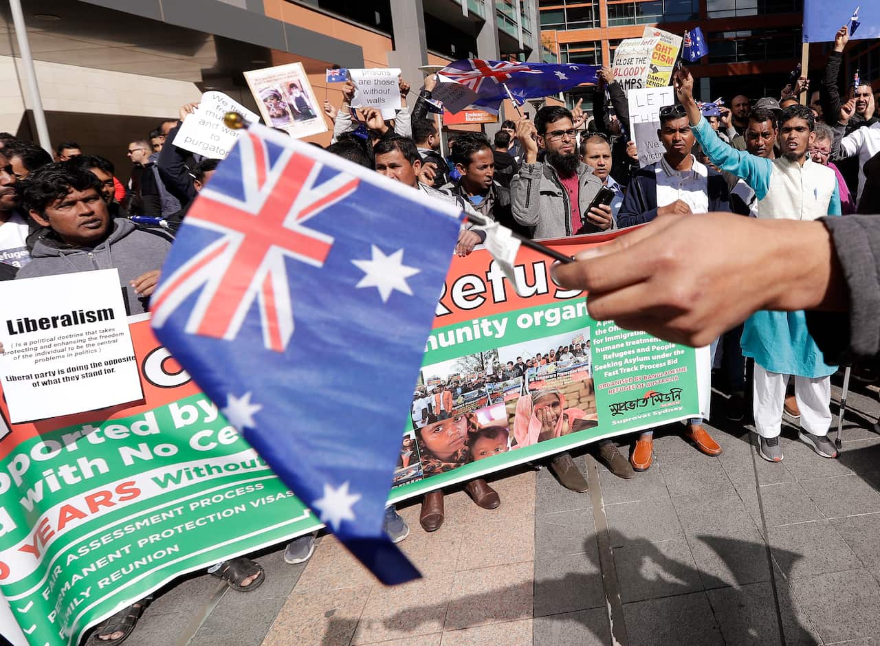 Hundreds protest the uncertain futures of many refugees since Australia replaced permanent protection visas with temporary visas in Sydney.