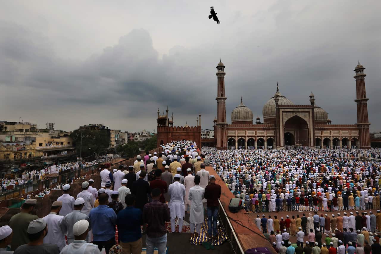 Muslims offer Eid al-Adha prayers at Jama Masjid in New Delhi, India.