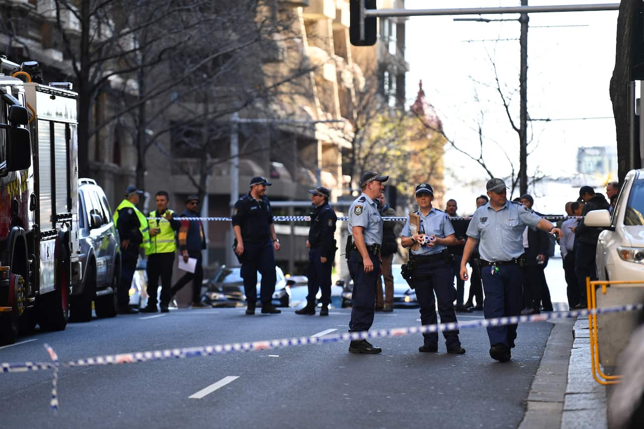 Police are seen during a police operation at the corner of King and York Street in Sydney, Tuesday, August 13, 2019.