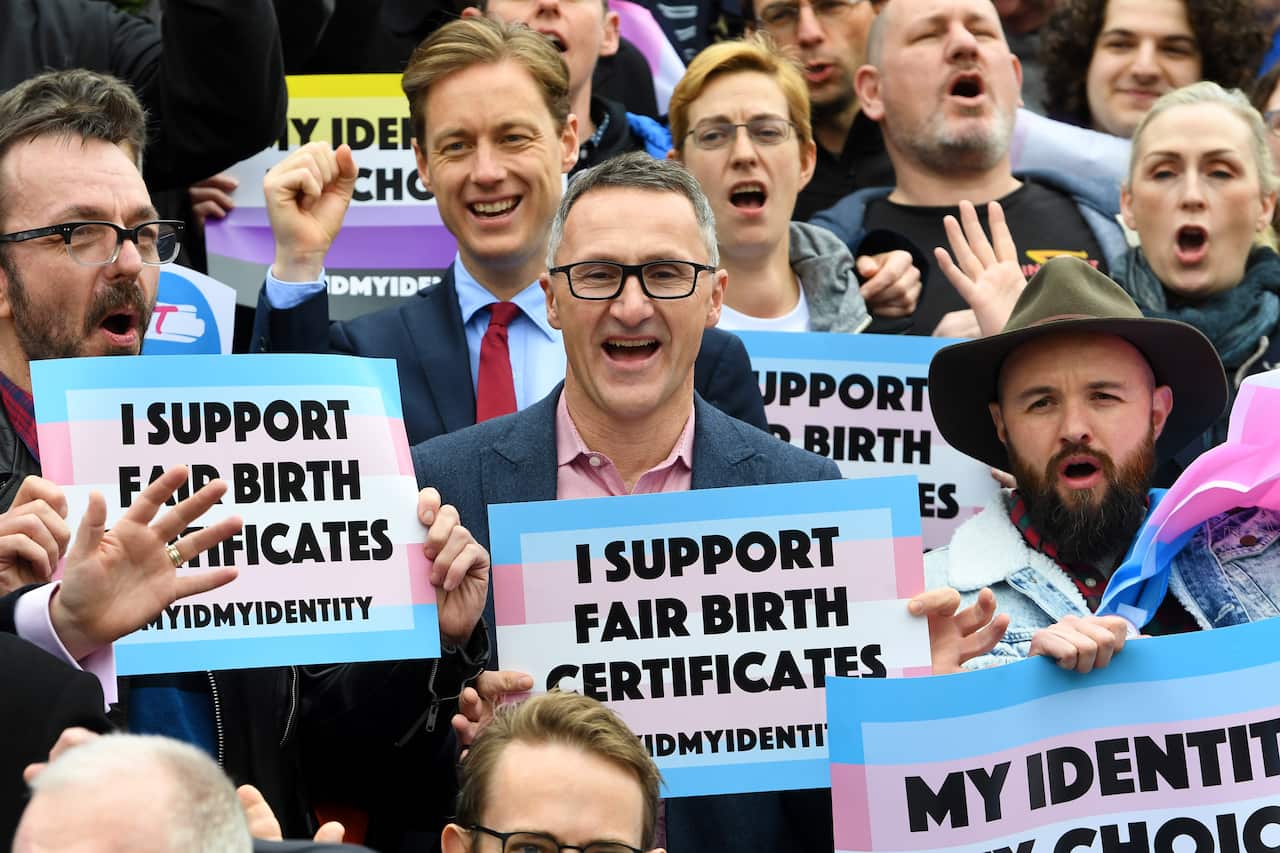 Richard Di Natale (centre) is seen with supporters of the gender diverse birth certificate bill outside Victoria's Parliament House.