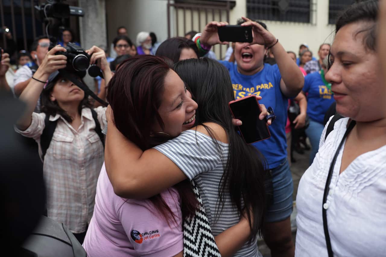 Evelyn Hernandez hugs Teodora Vazquez, who had her sentenced commuted after 10 years in jail over an abortion.