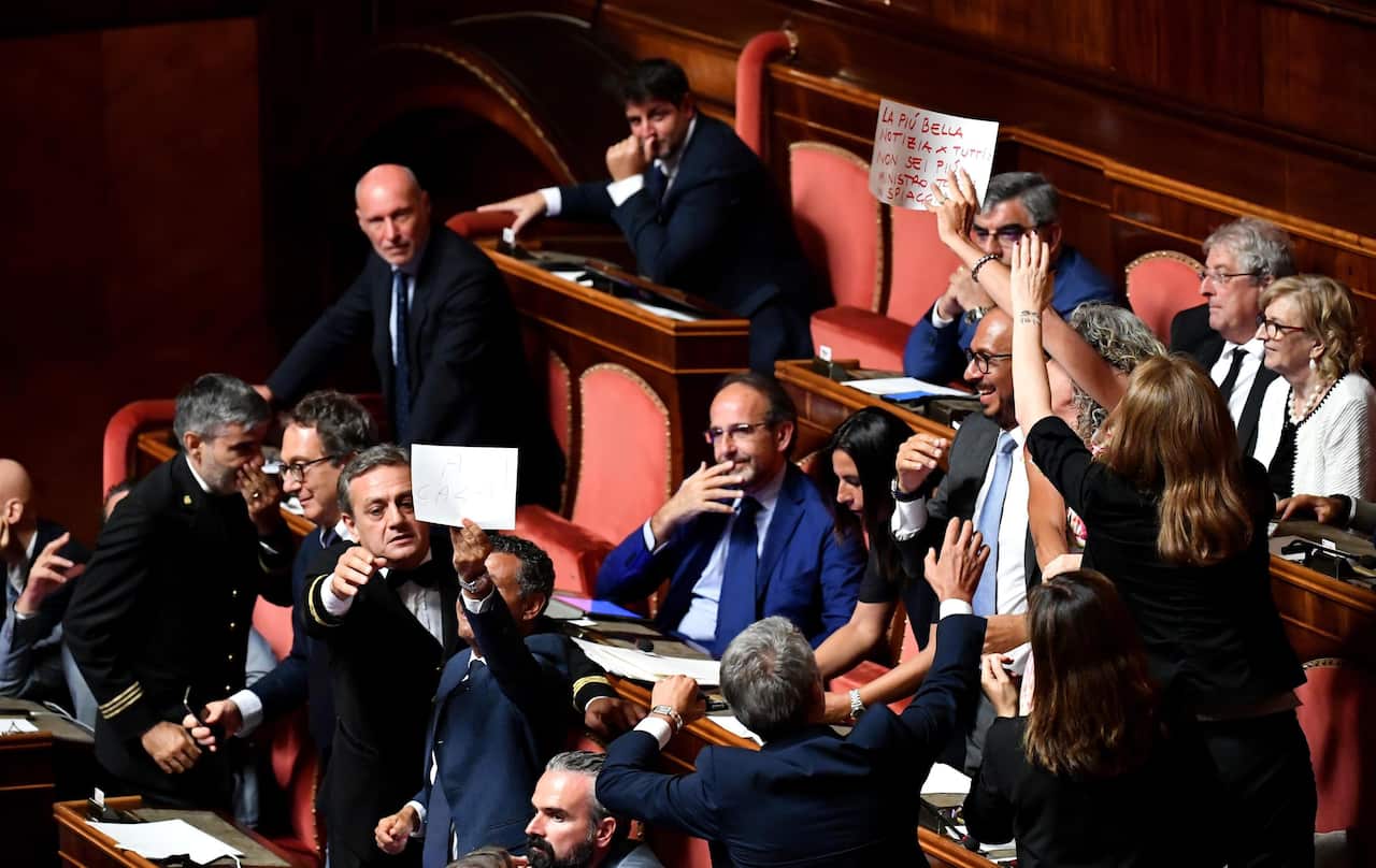 Senators display signs of protest against Deputy Prime Minister and Interior Minister Matteo Salvini.