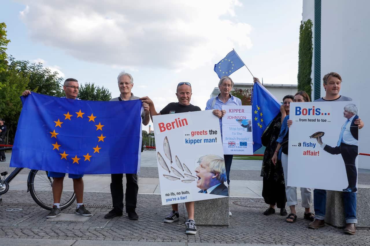 Demostrators hold European flags and banners in front of the Chancellery prior to the visit of British Prime Minister Boris Johnson in Berlin.