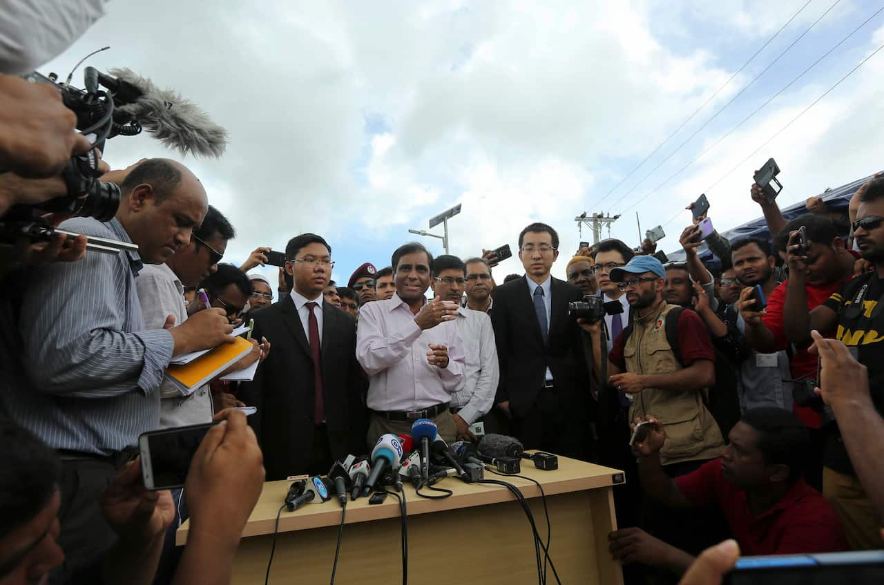 Bangladesh's refugee commissioner Abul Kalam, center, addresses media at Nayapara Rohingya refugee camp.