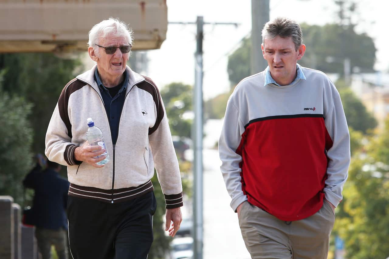 Witness Paul Savage (left)  arrives for the inquest into the disappearance of William Tyrrell at Taree Local Court.