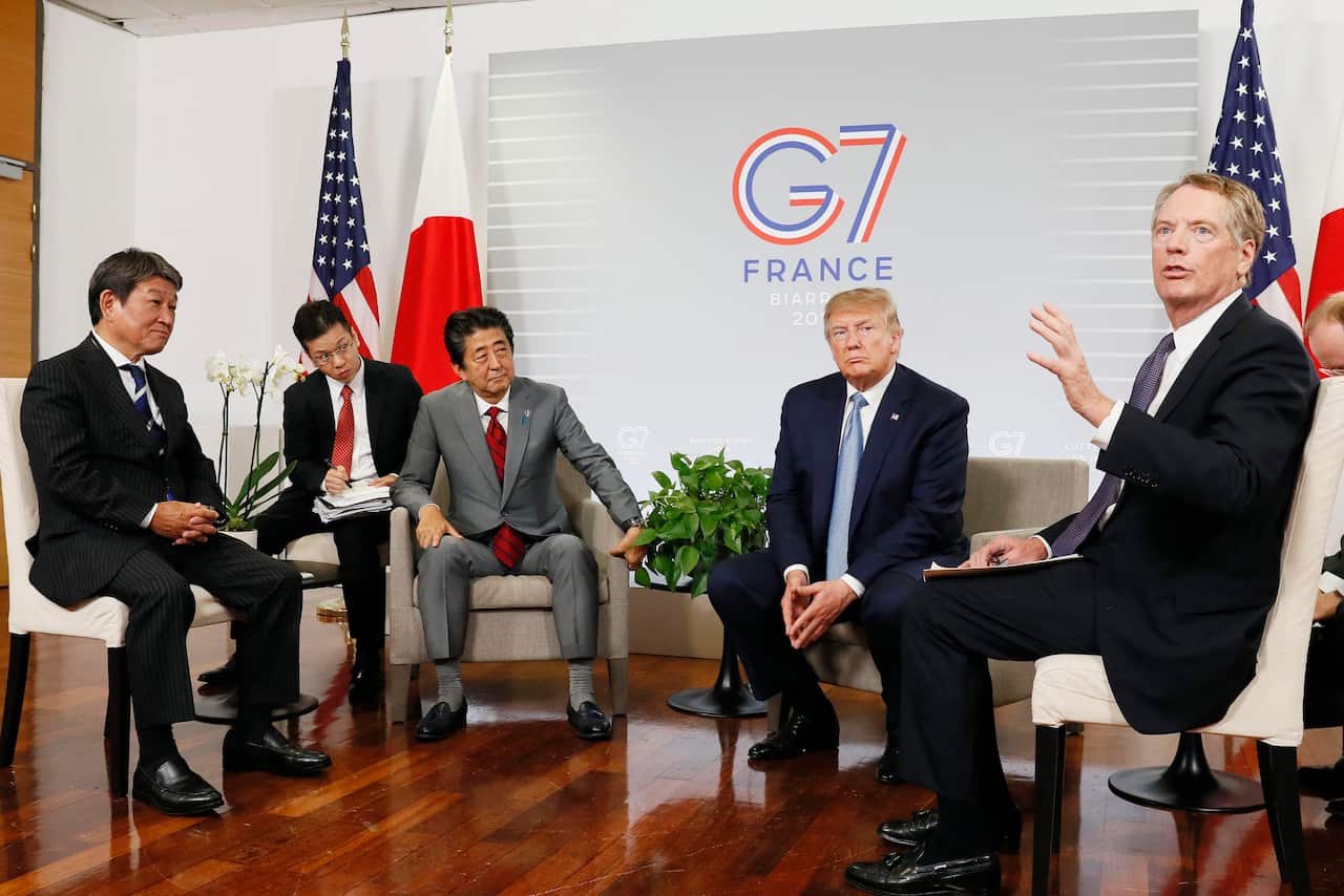 Japanese Prime Minister Shinzo Abe (3rd from L) and U.S. President Donald Trump (2nd from R) are pictured during their second meeting in Biarritz.