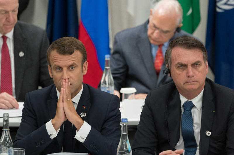 Emmanuel Macron and Jair Bolsonaro during a meeting on world economy at the first day of the G20 Summit in Osaka, Japan in June.
