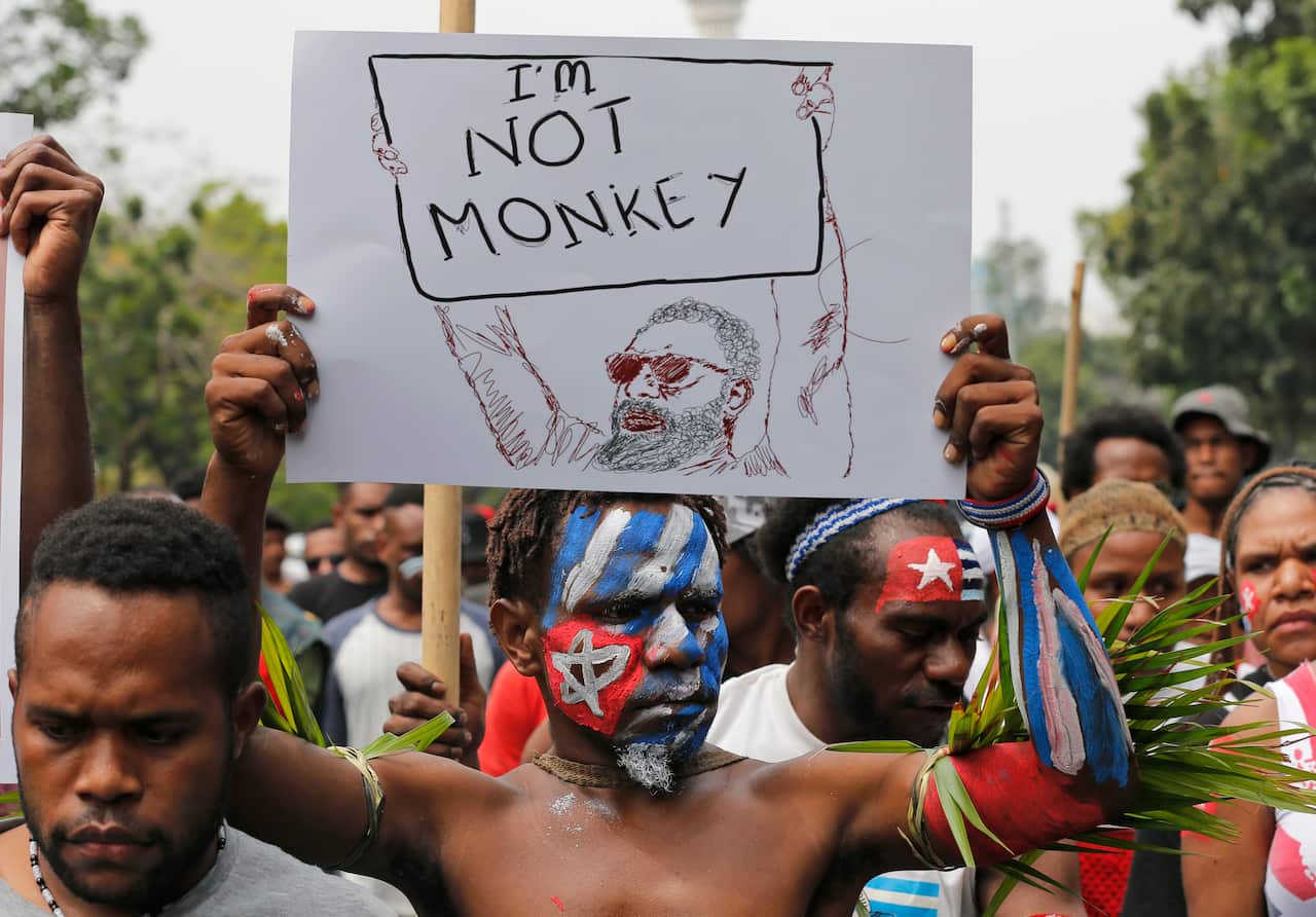 A Papuan students with faces painted with the colors of the separatist 'Morning Star' flag during a rally in Jakarta, Indonesia last month.