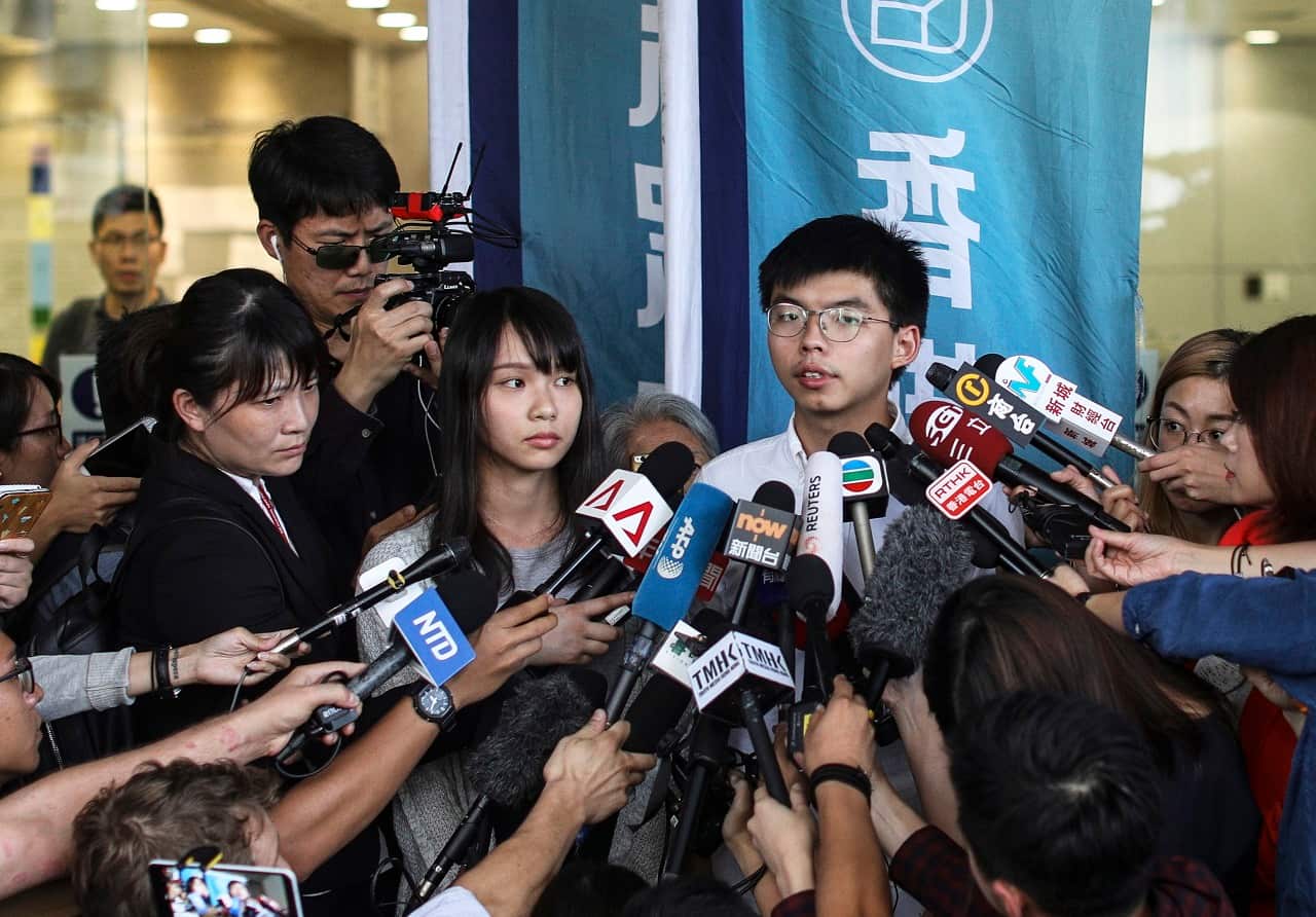 Joshua Wong talks to the press last month after being released on bail.