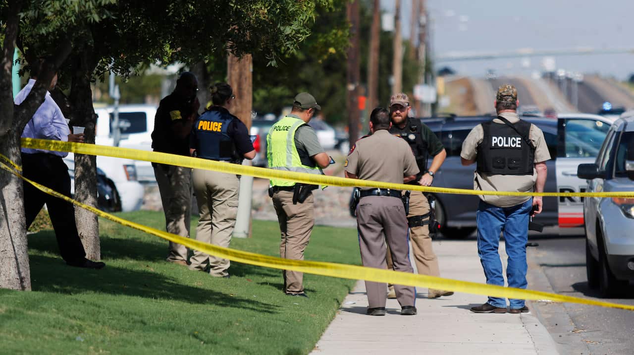 Odessa, Midand, Texas DPS and ATF officers cordon off a footpath.