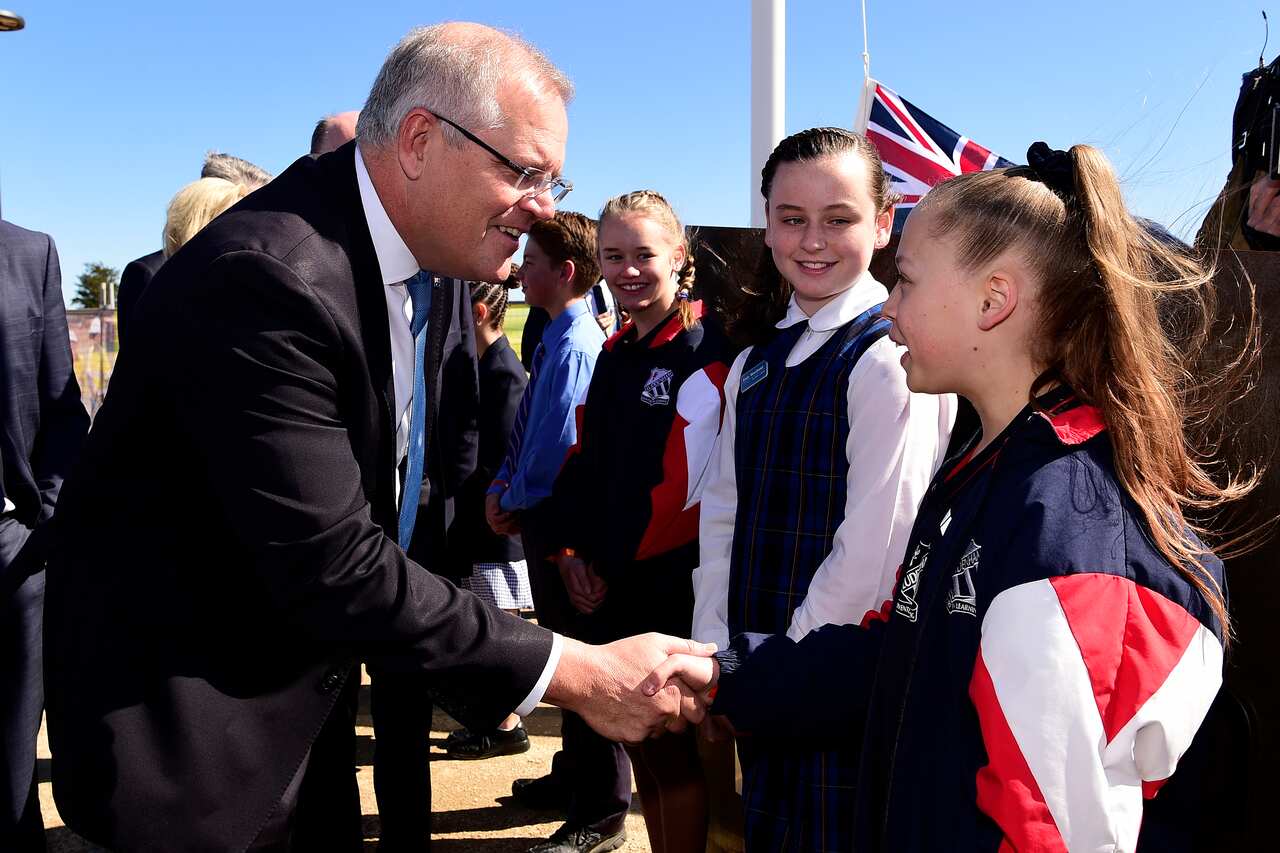 Prime Minister Scott Morrison is greeted by local primary school students as he arrives for the official opening of the Western Sydney International Experience Centre, Luddenham, NSW, Monday, September 2, 2019. ( AAP Image/Bianca De Marchi) NO ARCHIVING