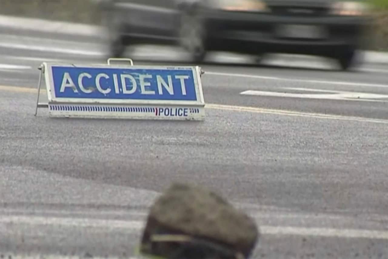 An accident sign is seen on road near a crash scene in Rotorua, New Zealand.