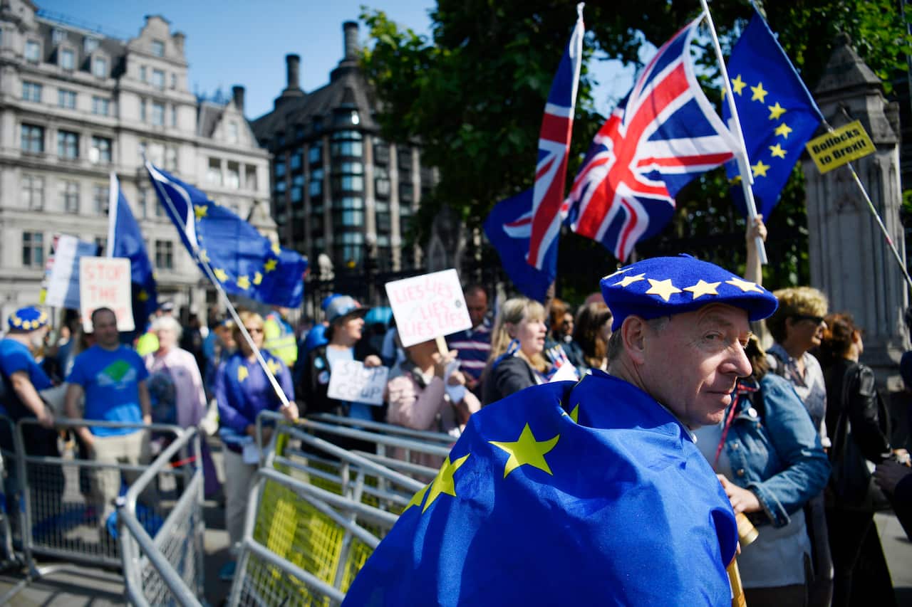 Pro-Remain protesters demonstrate outside Parliament in London.