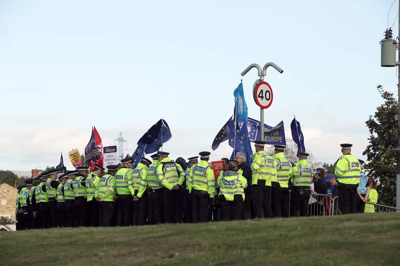 Police surround Brexit protesters as Prime Minister Boris Johnson visits West Yorkshire after promising to recruit an extra 20,000 police officers. 
