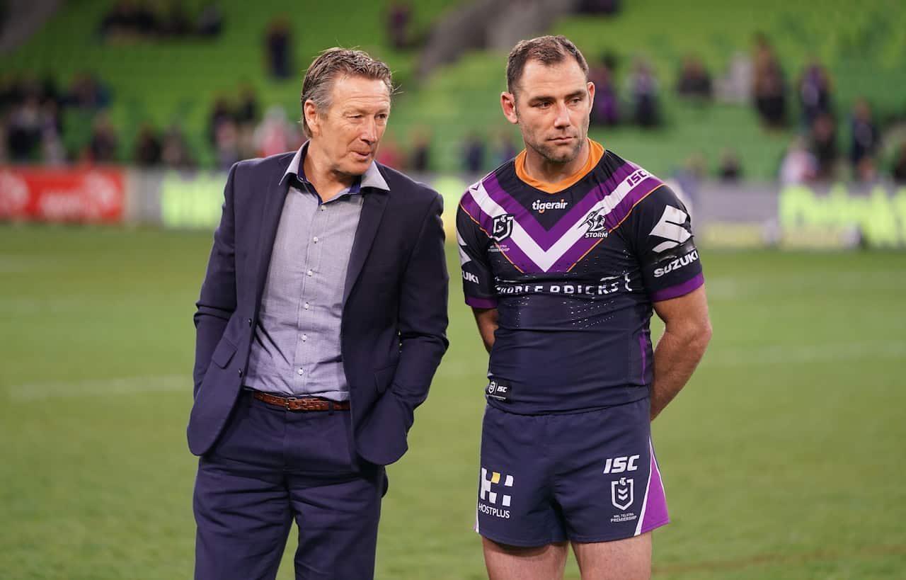 Melbourne Storm coach Craig Bellamy speaks with Cameron Smith.