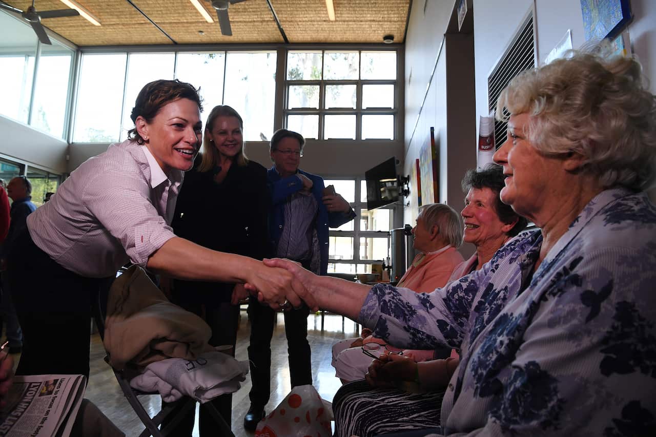 Queensland Deputy Premier Jackie Trad (left) meets evacuee Helen Burns at an evacuation centre in Noosa on the Sunshine Coast.