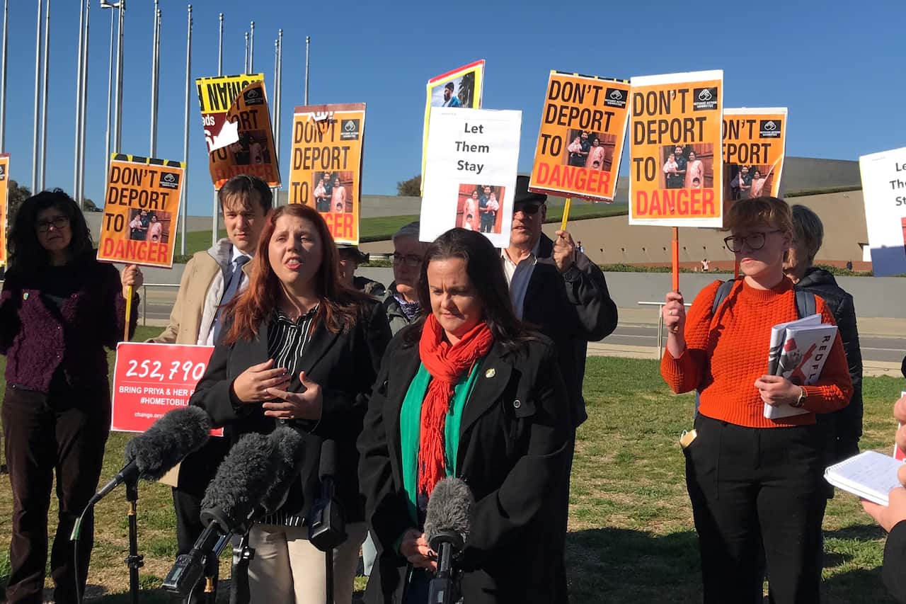Angela and Bronwyn deliver a petition with more than 250,000 signatures to the Federal Government in Canberra.