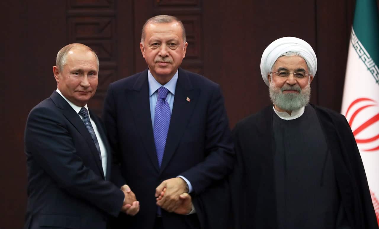 Turkish President Recep Tayyip Erdogan (C), Russian President Vladimir Putin (L) and Iranian President Hassan Rouhani (R) meet on Monday.