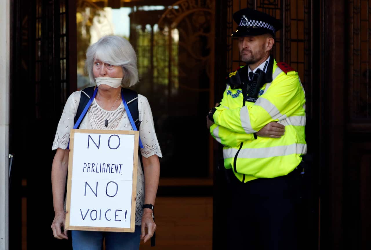 An anti-Brexit demonstrator protests outside  The Supreme Court in London. 