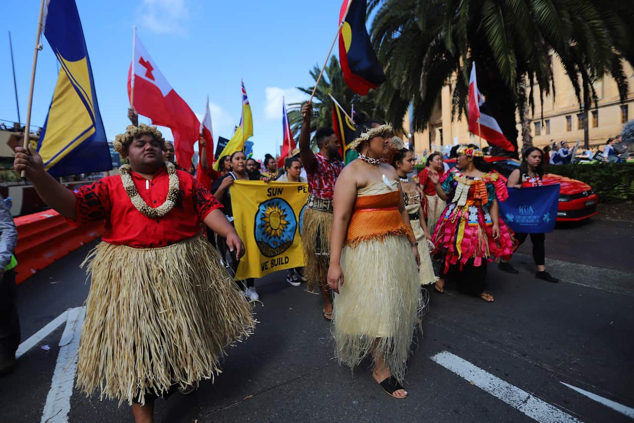 Protesters representing pacific island nations participate in The Global Strike 4 Climate rally in Sydney.