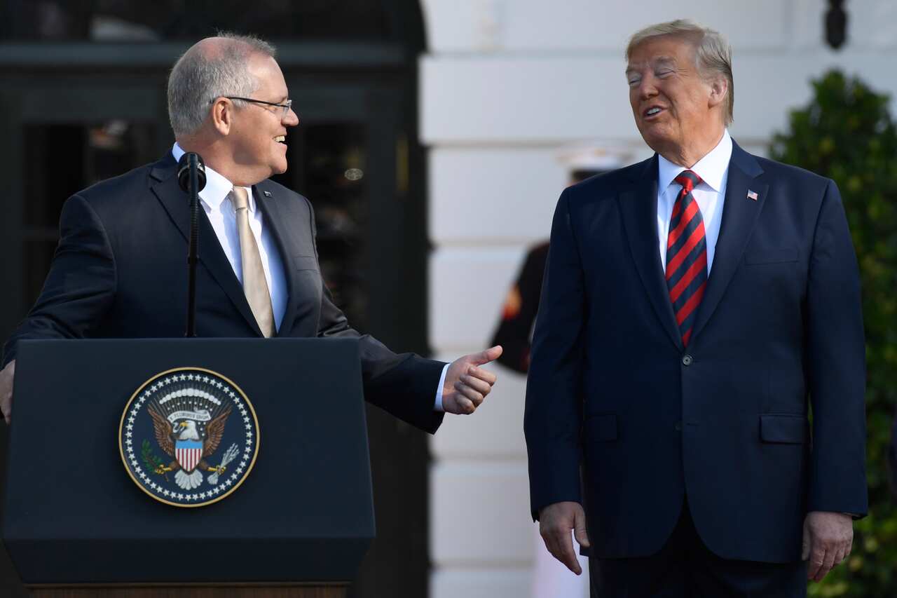 Australian Prime Minister Scott Morrison gestures toward President Donald Trump during a State Arrival Ceremony on the South Lawn of the White House in Washington, Friday, Sept. 20, 2019. (AP Photo/Susan Walsh)