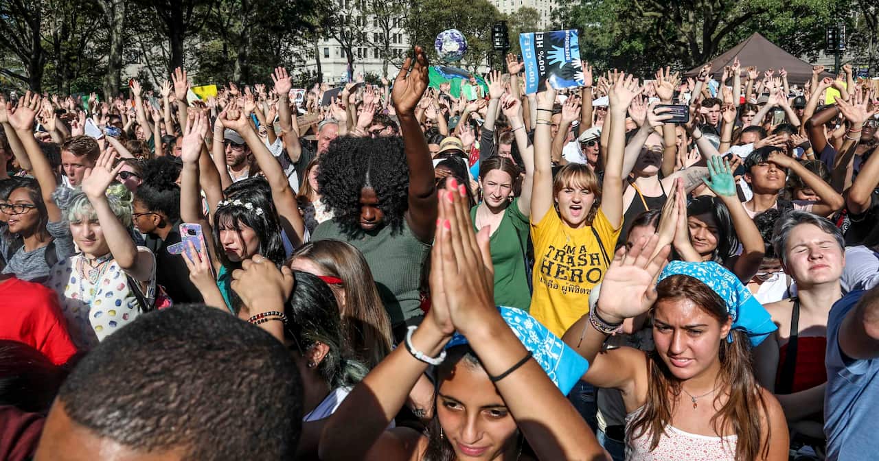 Climate change activists show hands in support of climate action during a climate strike rally, as part of a global youth-led day of global action, Friday Sept. 20, 2019, in New York. (AP Photo/Bebeto Matthews)