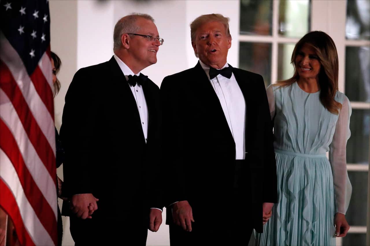 US President Donald Trump and first lady Melania Trump stand with Australian Prime Minister Scott Morrison.