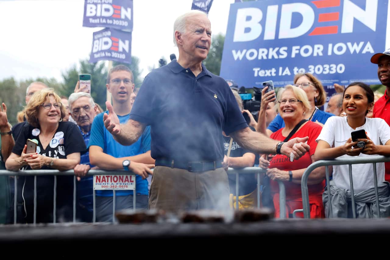 Democratic presidential candidate former Vice President Joe Biden works the grill during the Polk County Democrats Steak Fry, Saturday, Sept. 21, 2019, in Des Moines, Iowa. (AP Photo/Charlie Neibergall)