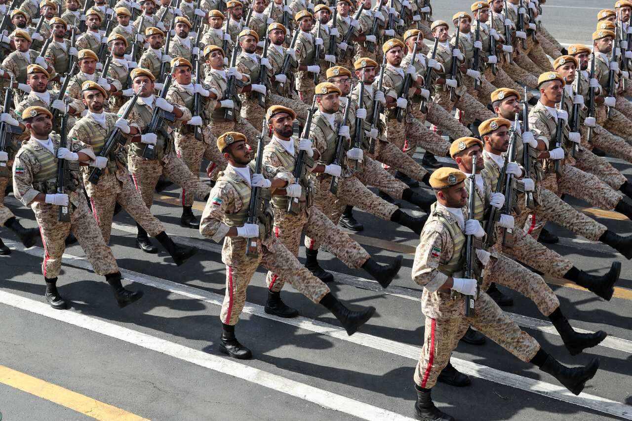 Iranian army troops march at a military parade marking 39th anniversary of outset of Iran-Iraq war.
