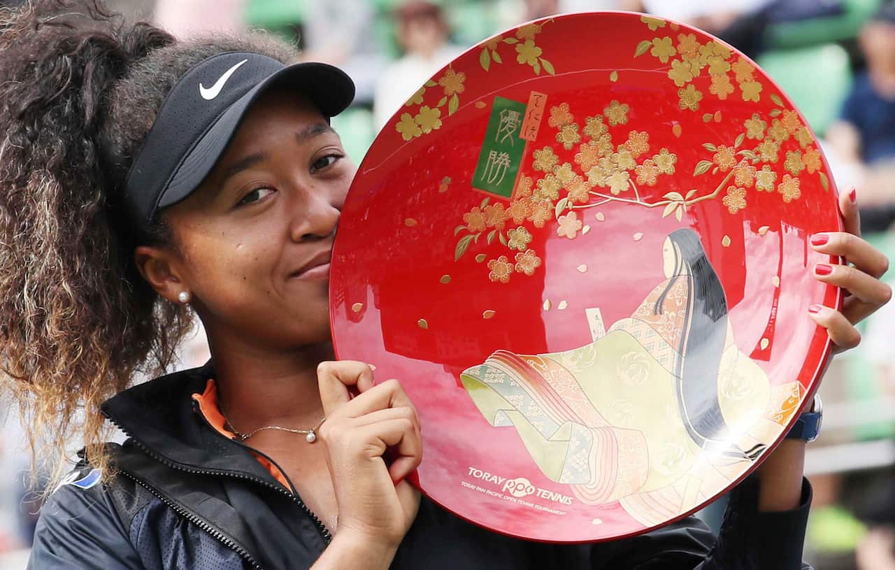 Naomi Osaka celebrates after winning the Toray Pan Pacific Open