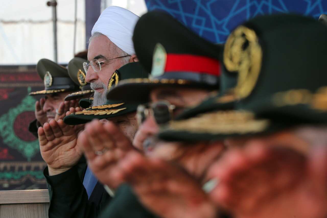 Iranian President Hassan Rouhani watches the annual military parade marking the Iraqi invasion in 1980, which led to an eight-year-long war in Tehran, Iran.